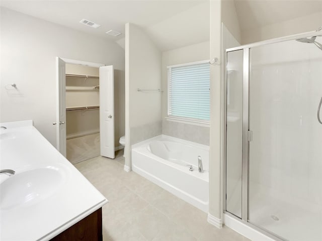 full bathroom featuring toilet, vaulted ceiling, independent shower and bath, and vanity