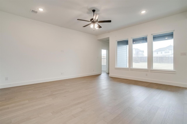 spare room with ceiling fan and light hardwood / wood-style flooring