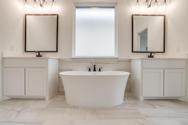 bathroom with tile walls, vanity, and a bath