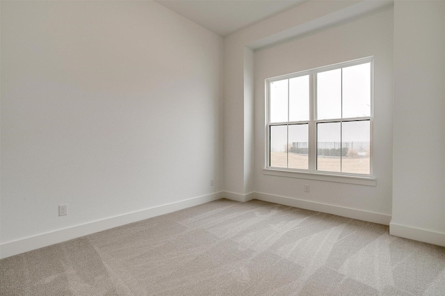 empty room with light colored carpet