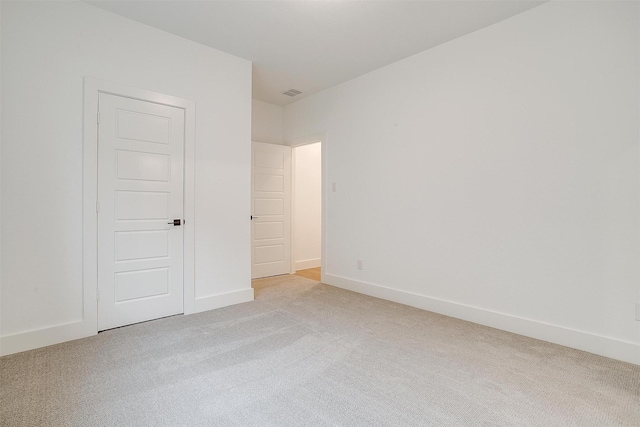 unfurnished bedroom with light colored carpet