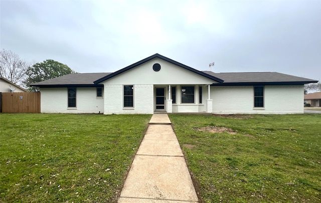 single story home featuring a front yard