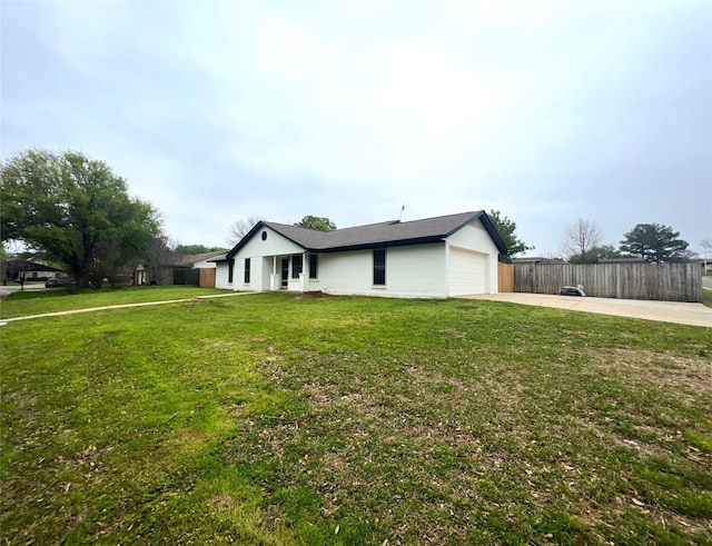 ranch-style home with a front yard and a garage