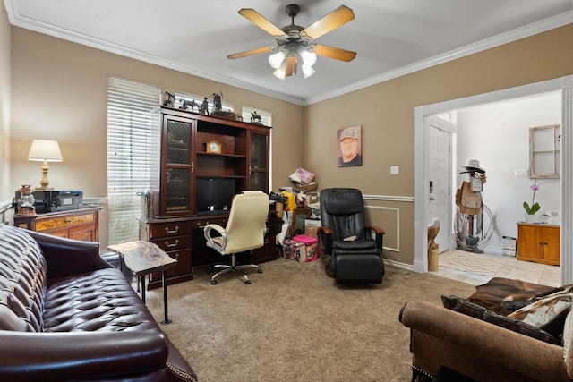 carpeted home office with crown molding and ceiling fan