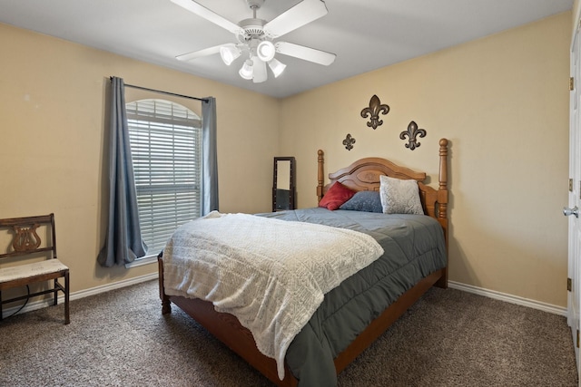 bedroom with ceiling fan and dark colored carpet