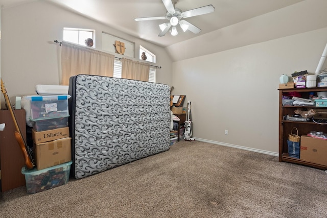 interior space featuring vaulted ceiling, ceiling fan, and carpet floors