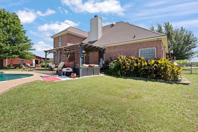 rear view of property with a patio, a fenced in pool, a pergola, a lawn, and outdoor lounge area