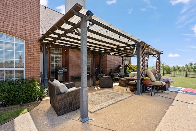 view of patio with a pergola, a grill, and an outdoor hangout area