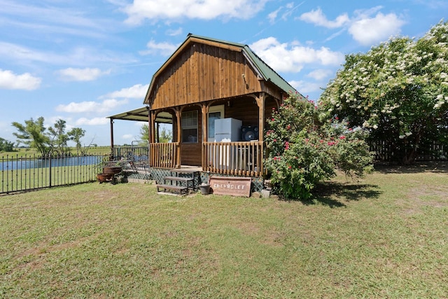 exterior space with a front yard and a water view