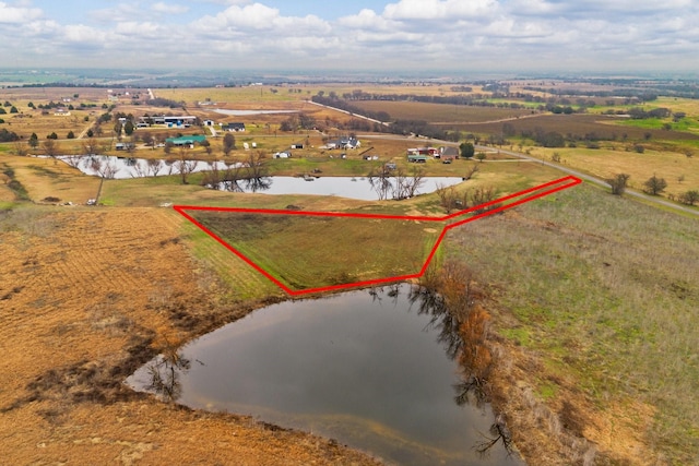 bird's eye view featuring a water view and a rural view