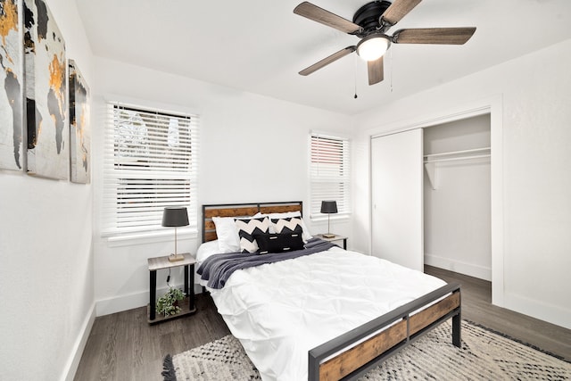 bedroom featuring a closet, wood finished floors, a ceiling fan, and baseboards