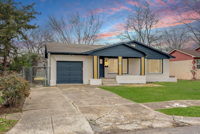 view of front of property with driveway, an attached garage, a front lawn, a porch, and brick siding