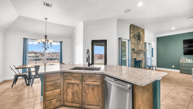 157 Churchill Cir, Weatherford, TX 76085 - kitchen featuring stainless steel dishwasher, light tile patterned floors, open floor plan, a chandelier, and pendant lighting