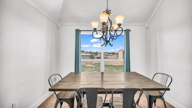 dining area with baseboards, a chandelier, and crown molding