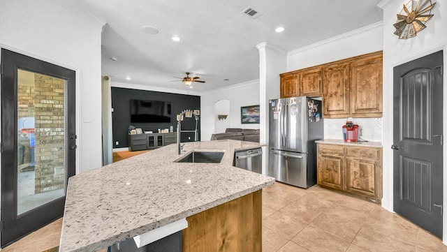 157 Churchill Cir, Weatherford, TX 76085 - kitchen featuring stainless steel appliances, ceiling fan, crown molding, light stone counters, and light tile patterned floors