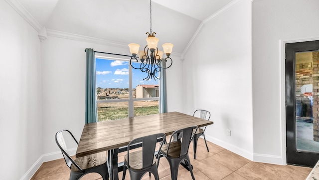 dining area with ornamental molding, lofted ceiling, a chandelier, and baseboards