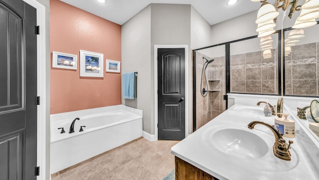 full bath featuring a garden tub, double vanity, a sink, and a tile shower