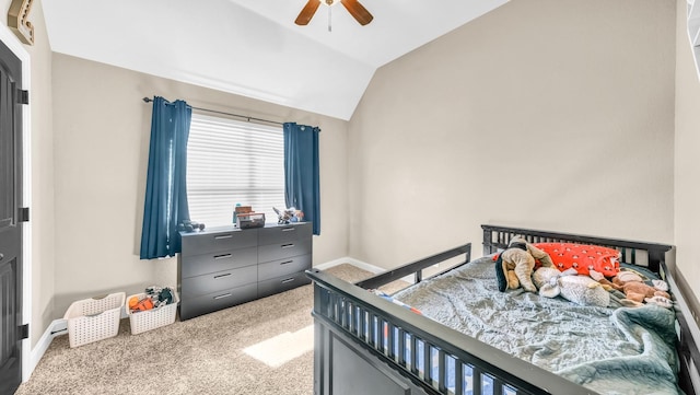 bedroom featuring carpet, vaulted ceiling, baseboards, and ceiling fan