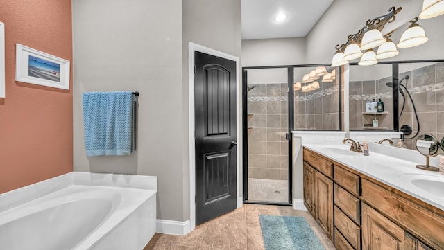 157 Churchill Cir, Weatherford, TX 76085 - bathroom featuring a shower stall, a bath, double vanity, and tile patterned flooring
