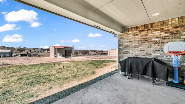 view of yard featuring a patio and a residential view