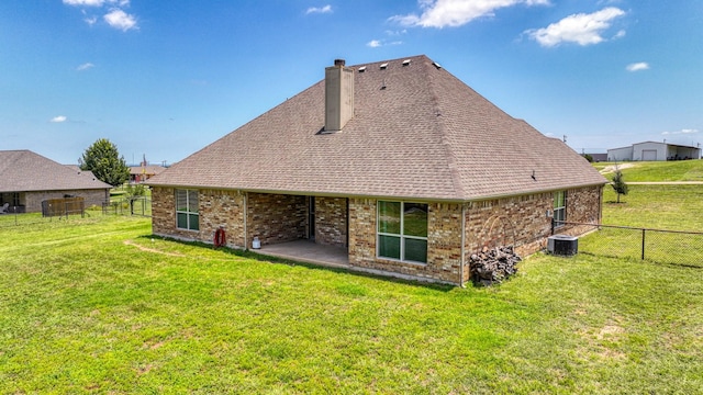 157 Churchill Cir, Weatherford, TX 76085 - rear view of property featuring a chimney, a fenced backyard, brick siding, and roof with shingles