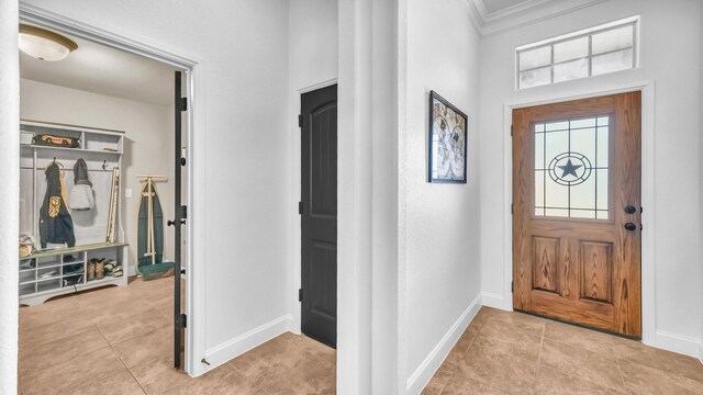 157 Churchill Cir, Weatherford, TX 76085 - tiled entryway featuring crown molding and a high ceiling