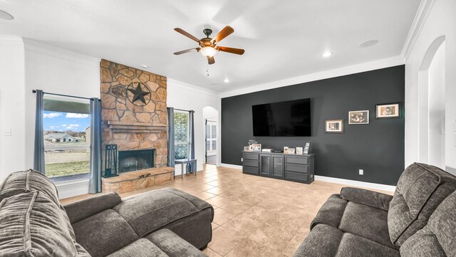 157 Churchill Cir, Weatherford, TX 76085 - living room with arched walkways, a ceiling fan, ornamental molding, a fireplace, and recessed lighting