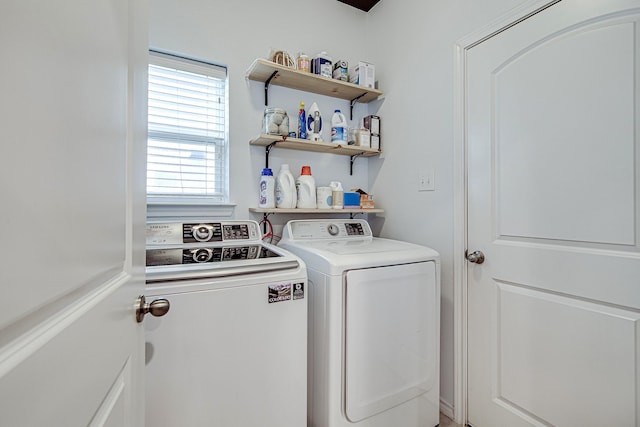 laundry area with laundry area and separate washer and dryer