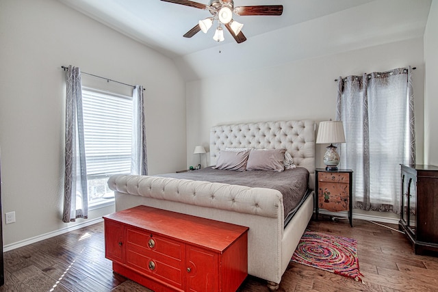 bedroom with vaulted ceiling, a ceiling fan, baseboards, and wood finished floors