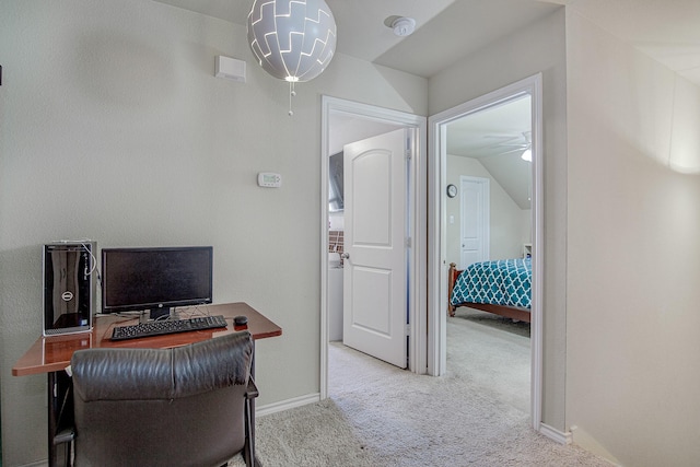 carpeted office featuring baseboards