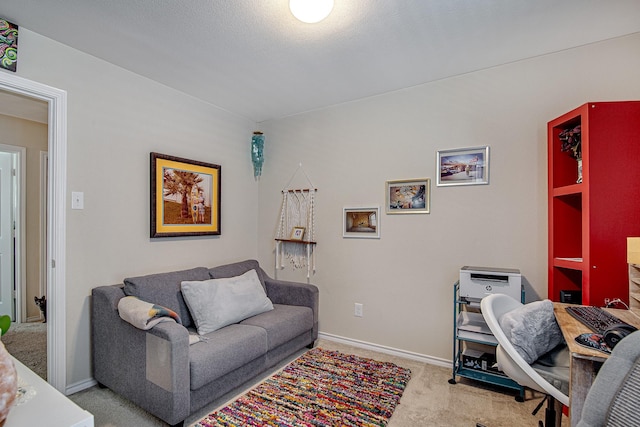 interior space featuring baseboards and carpet