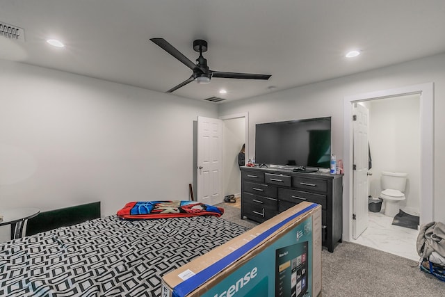 carpeted bedroom featuring ensuite bathroom and ceiling fan