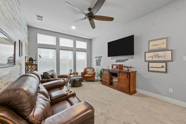 carpeted living area with ceiling fan, visible vents, baseboards, and recessed lighting