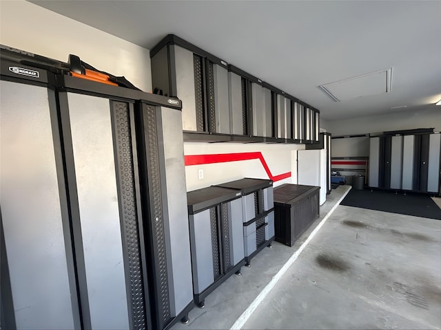 garage with freestanding refrigerator