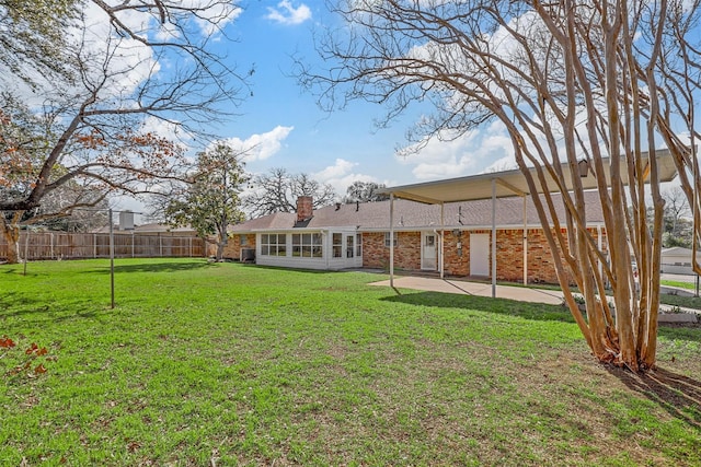 view of yard featuring a patio area and a fenced backyard