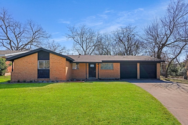 single story home featuring a front lawn and a garage