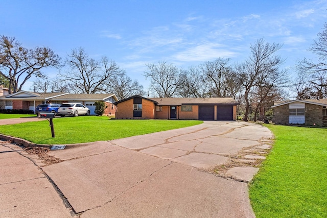 ranch-style house featuring a garage and a front yard