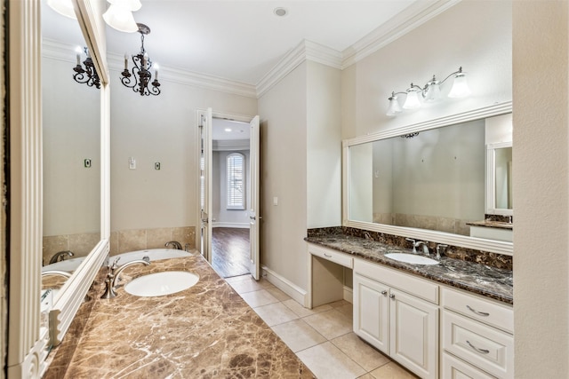 bathroom with a bath, tile patterned floors, vanity, and ornamental molding