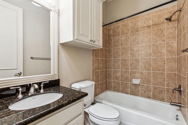 full bathroom with toilet, vanity, and tiled shower / bath combo