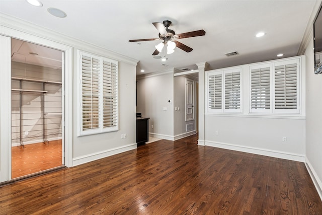 unfurnished bedroom with ceiling fan, crown molding, and dark hardwood / wood-style flooring