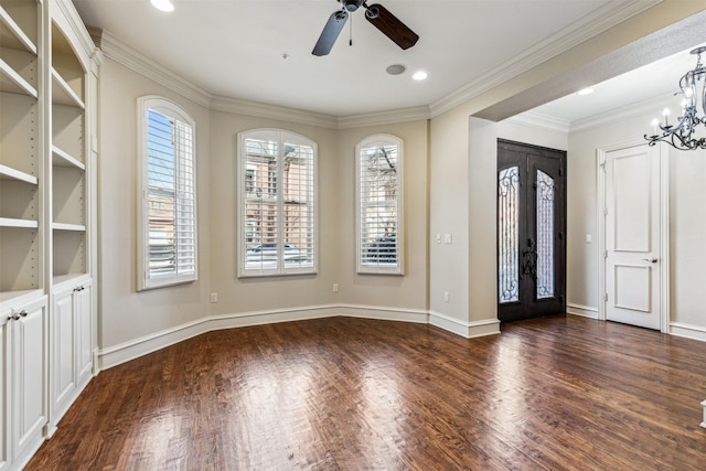 foyer featuring ornamental molding, dark hardwood / wood-style flooring, and ceiling fan with notable chandelier