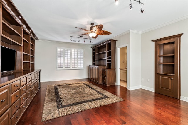 unfurnished living room with ceiling fan, crown molding, dark hardwood / wood-style floors, and built in shelves