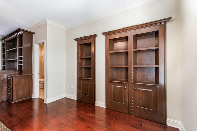 interior space featuring ornamental molding and dark hardwood / wood-style floors