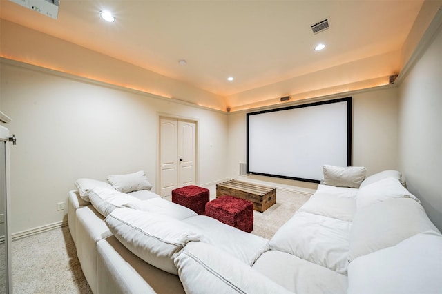 cinema room featuring light colored carpet