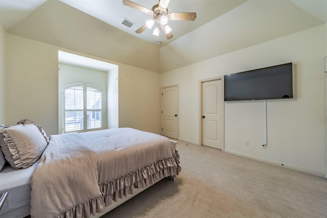 carpeted bedroom with ceiling fan and lofted ceiling