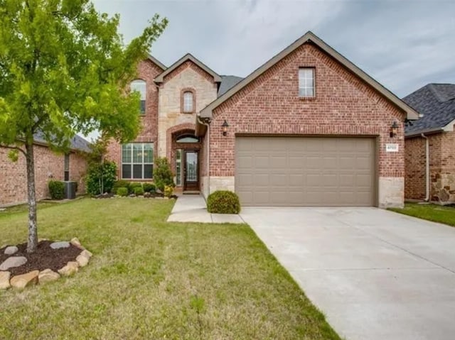 view of front of house featuring a garage, brick siding, concrete driveway, stone siding, and a front yard