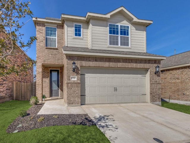 view of front of house featuring driveway, brick siding, an attached garage, and fence