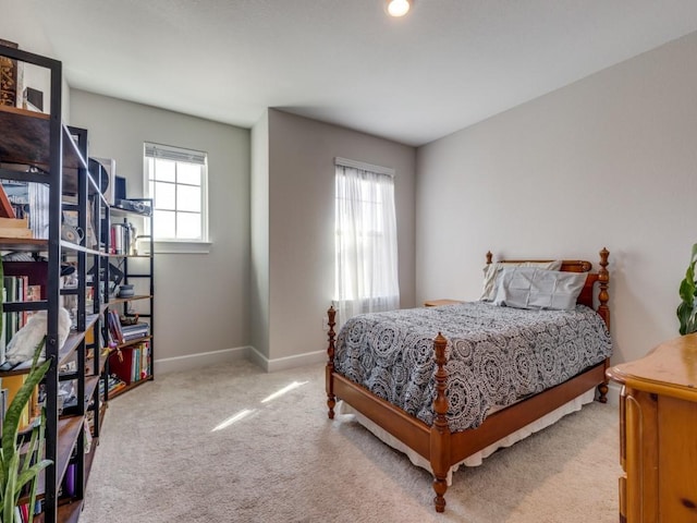 bedroom with baseboards and carpet floors