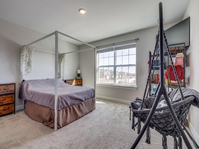 bedroom with carpet flooring and baseboards