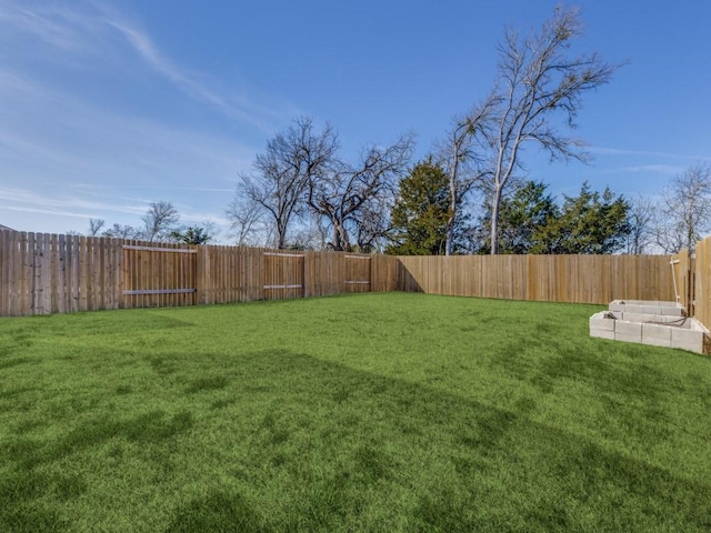 view of yard featuring a fenced backyard